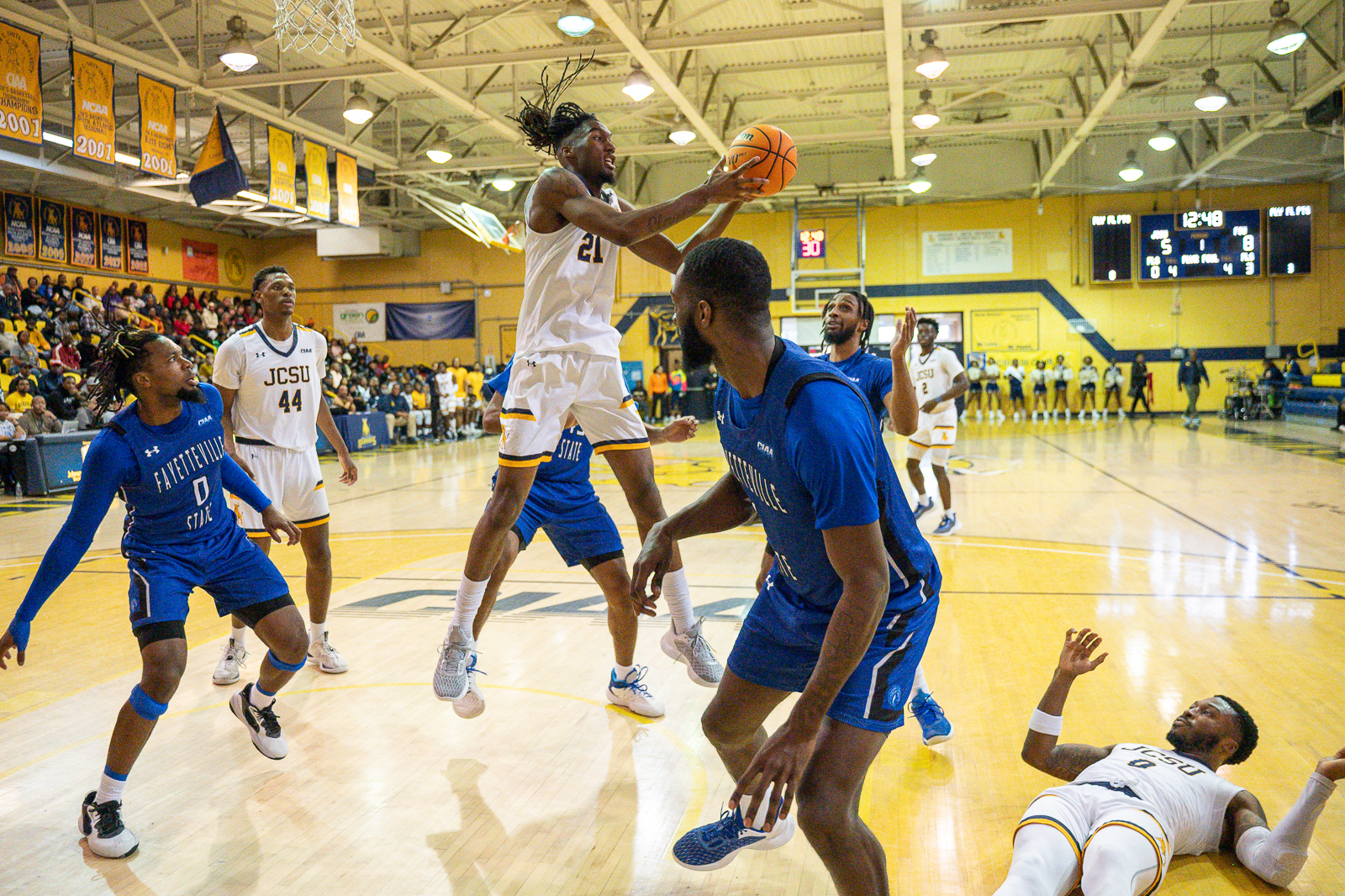 Johnson C. Smith basketball forward Asa White grabs a rebound against Fayetteville State