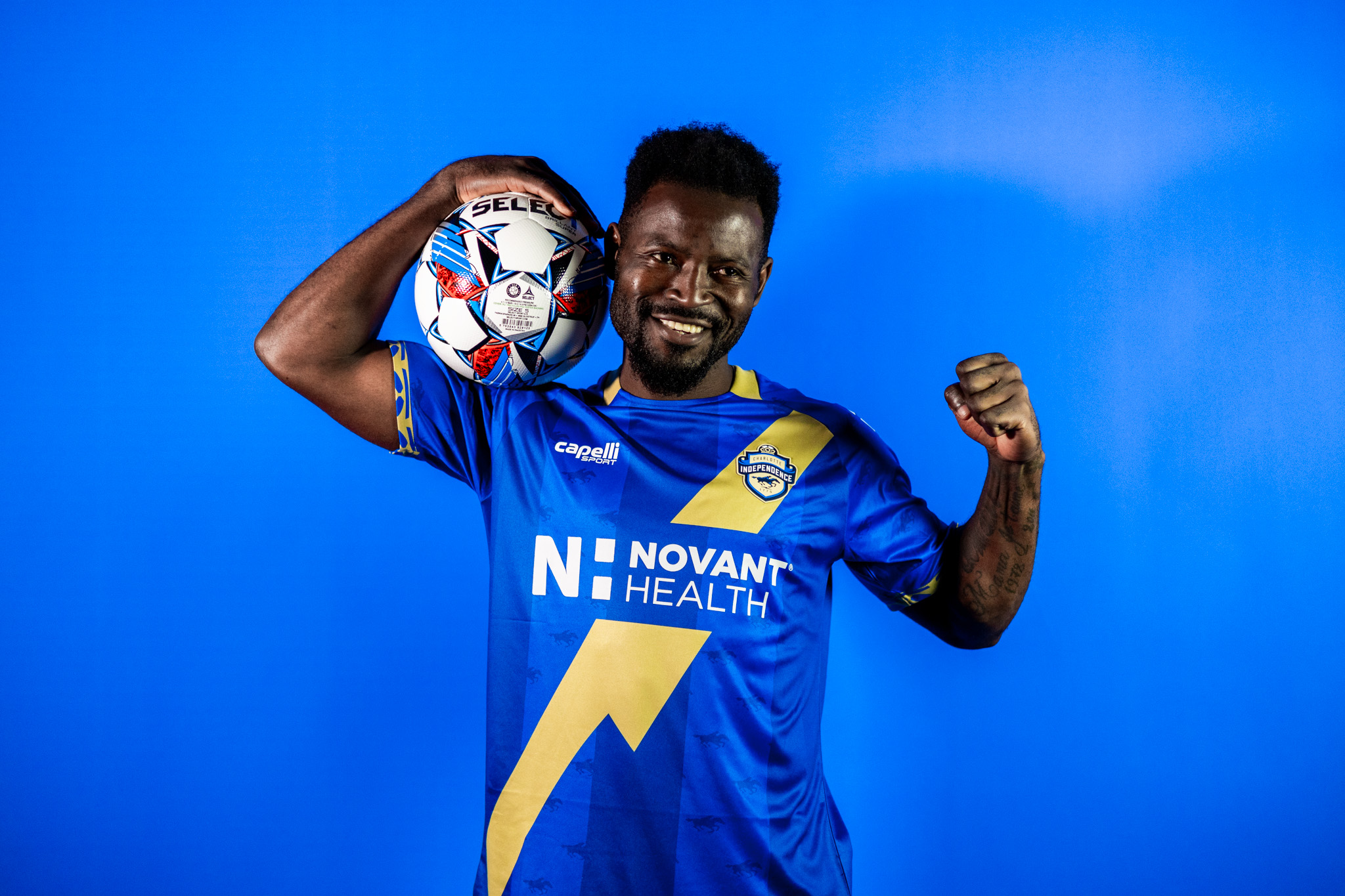 Fabrice Ngah models the Charlotte Independence 2024 jersey at media day.