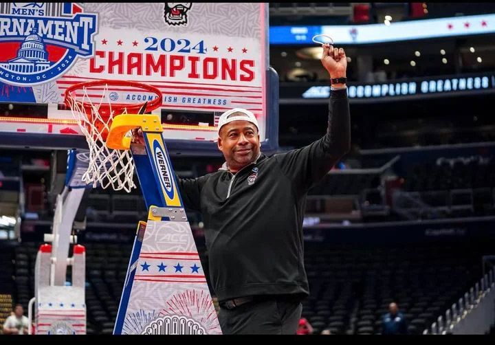 North Carolina State assistant basketball coach Larry Dixon celebrates after the Wolfpack won the ACC title in Washington, D.C.,
