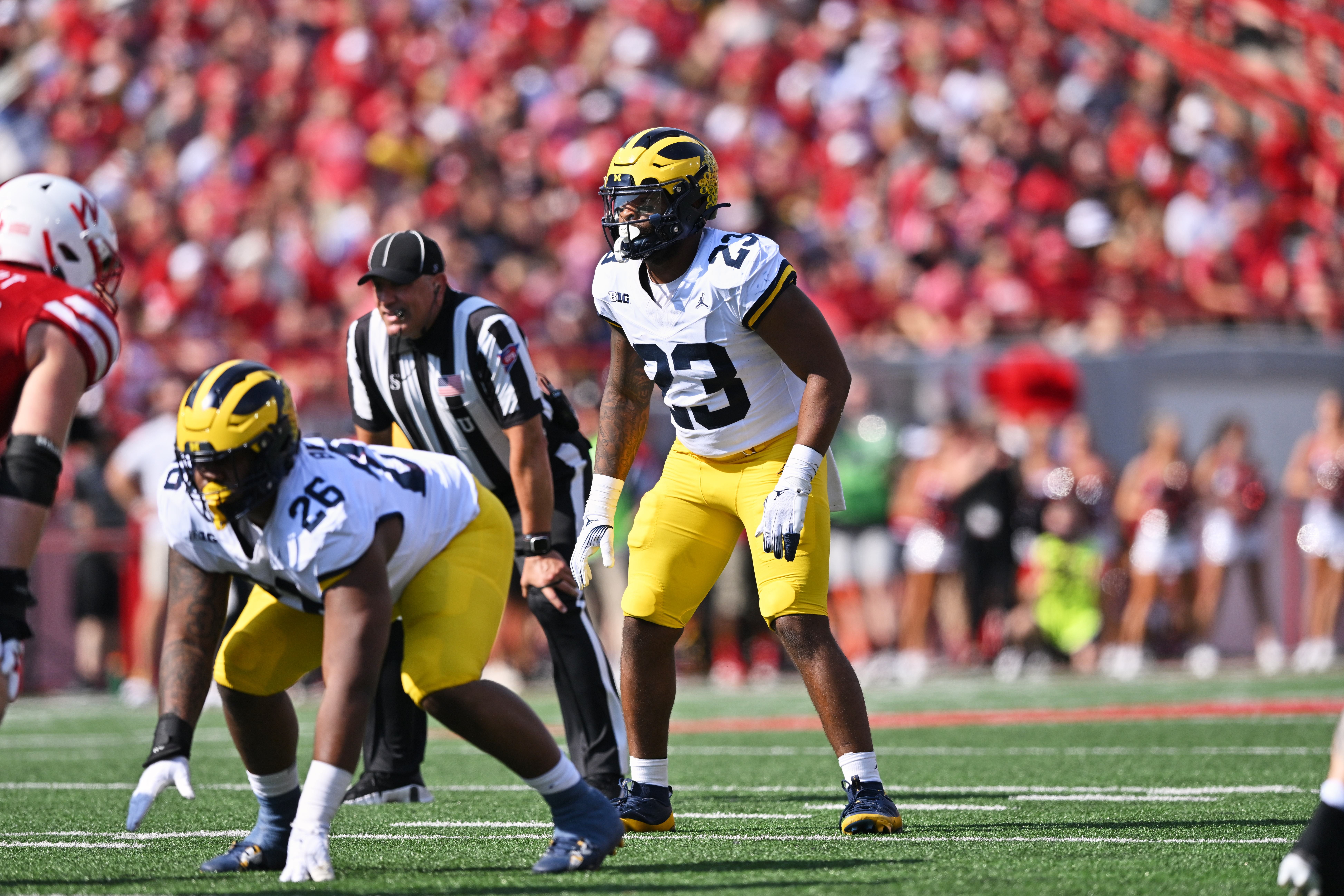 Michigan linebacker Mike Barrett awaits the start of a play against Nebraska
