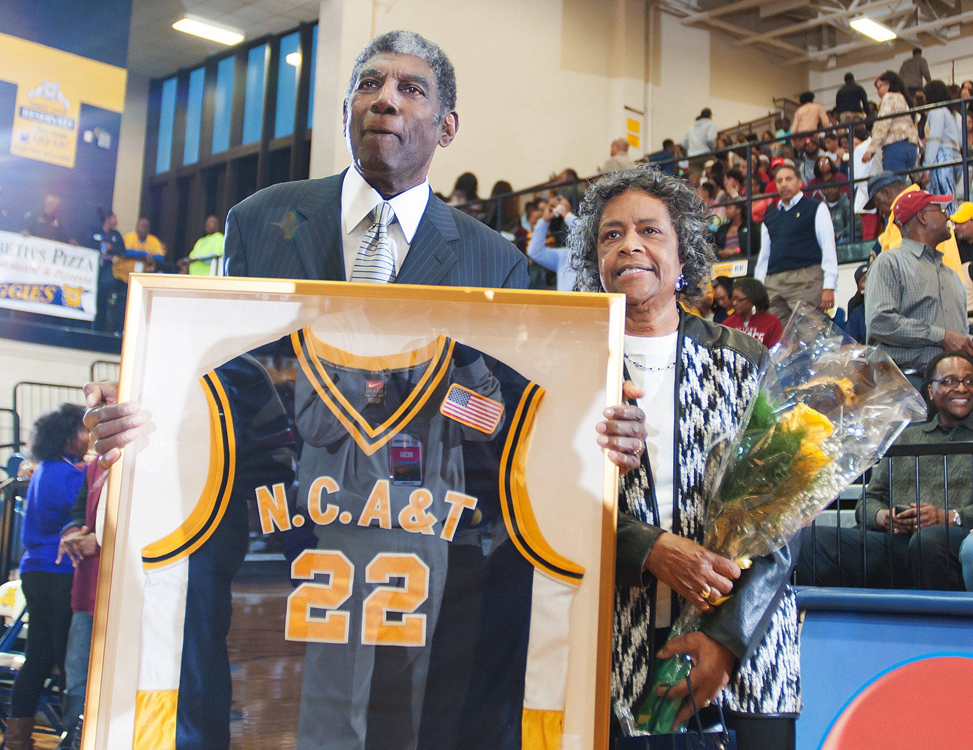 Al Attles holds his jersey at North Carolina A&T number retirement ceremony