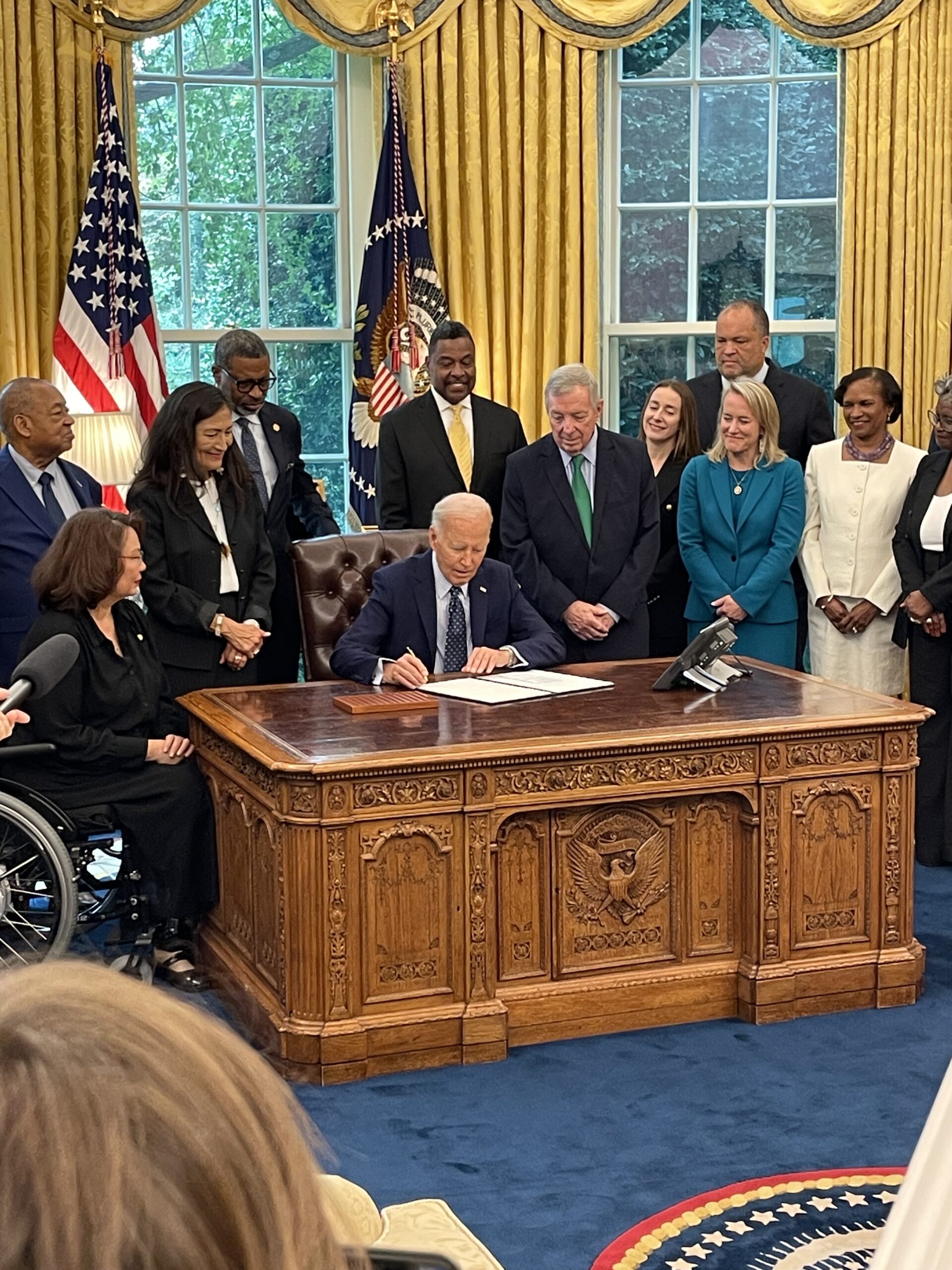 President Joe Biden signs a proclamation marking the 116th anniversary of the Springfield Race Riot in Illinois