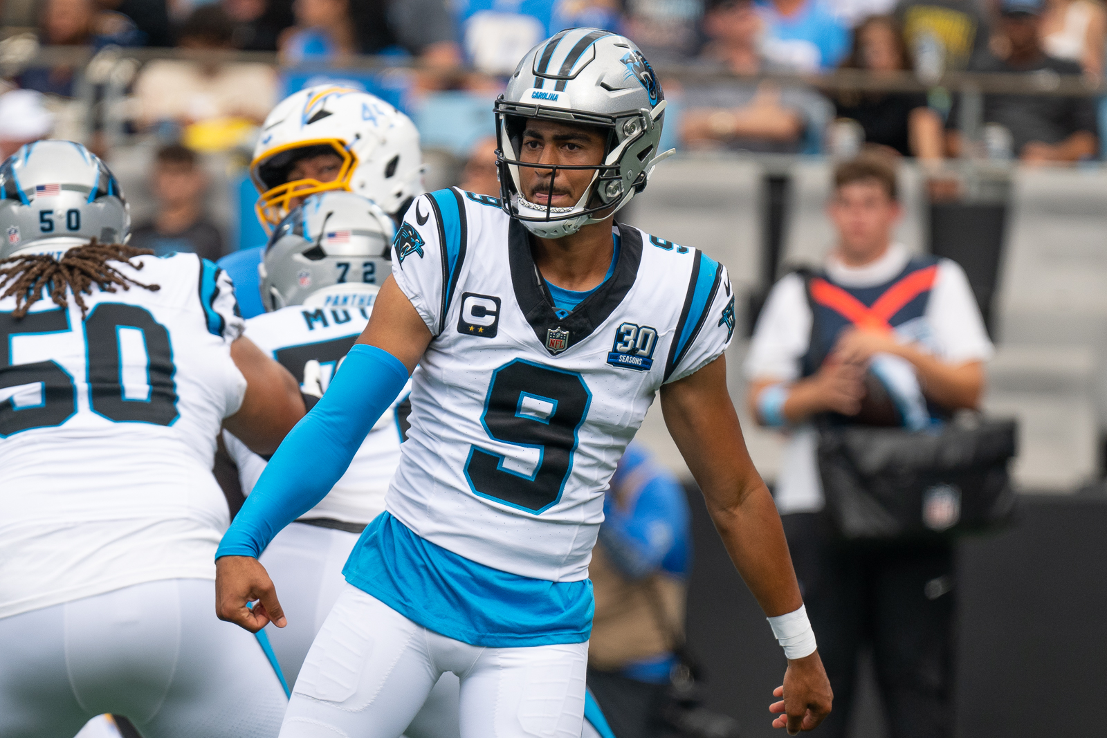 Bryce Young looks after throwing a pass